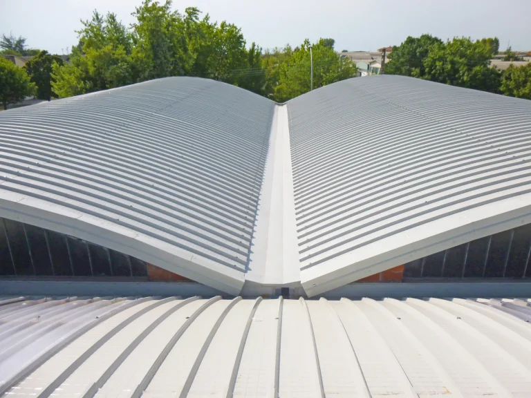 A modern educational building featuring a twin-skin cladding system installed by S & G Industrial Roofing. The structure has a durable, energy-efficient façade designed to enhance insulation and aesthetics for schools and universities.